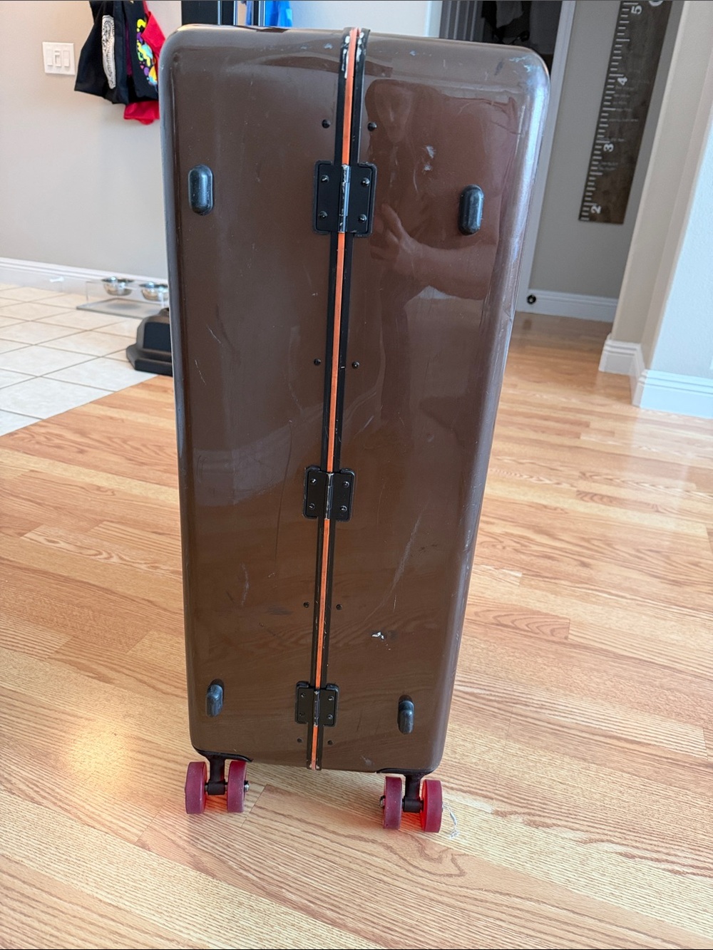 Floyd Brown Hardshell Suitcase with Bright Orange Interior and Red Wheels - Picture 10 of 17